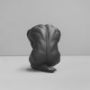 Modern black art sculpture showing reflective human form