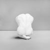 Artistic resin male sculpture in reflective pose styled in a cosy interior