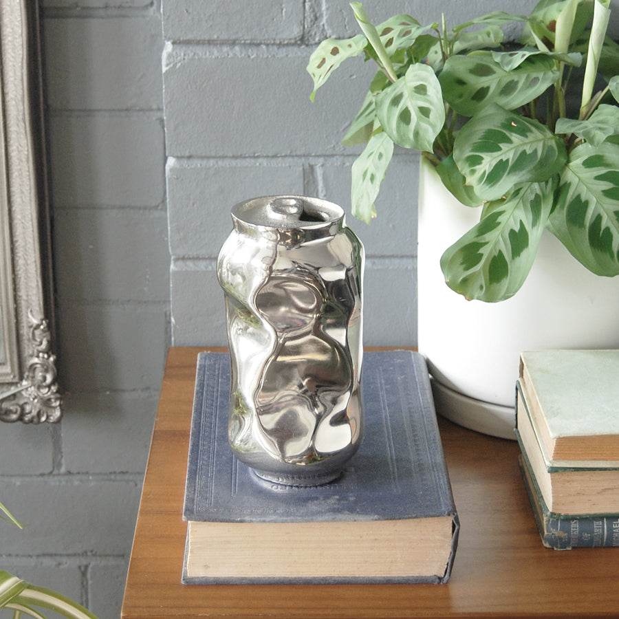 Decorative silver vase with crushed can design