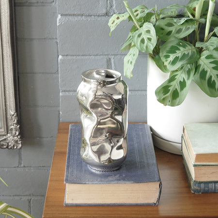 Decorative silver vase with crushed can design
