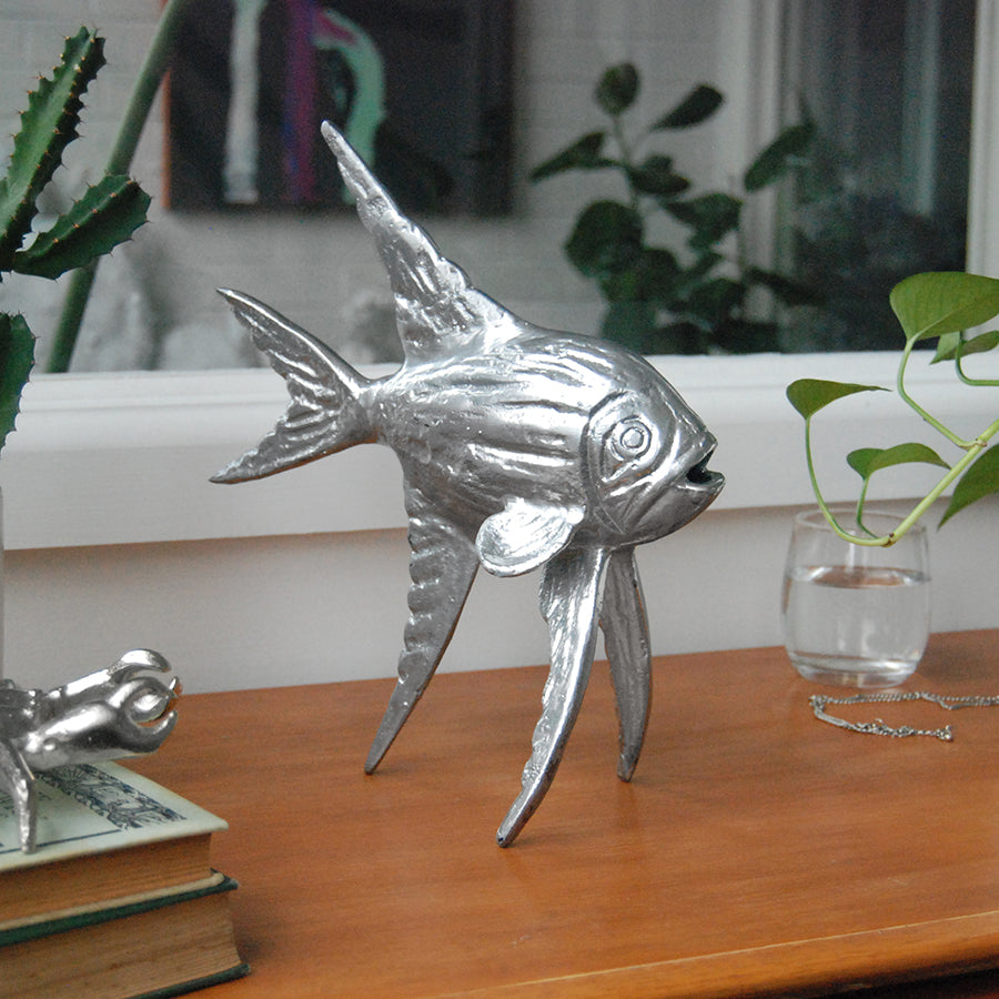 Decorative silver fish ornament with tall textured fins