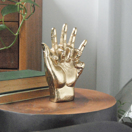 Decorative intertwined hands ornament in gold finish