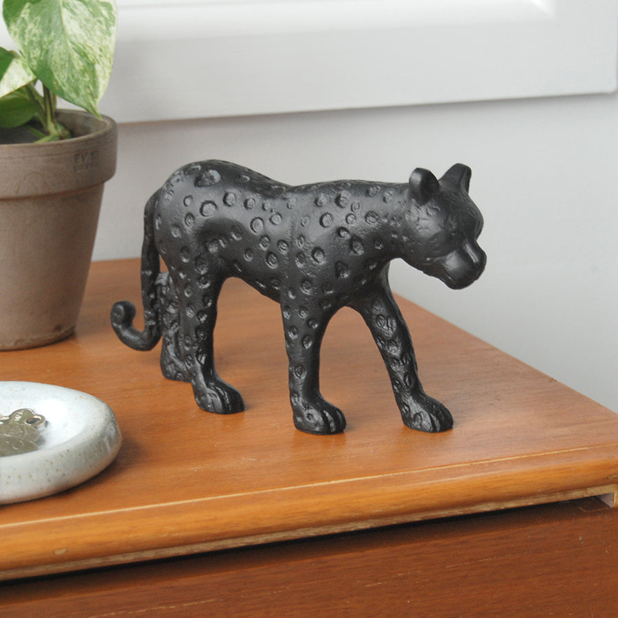 Decorative black leopard figurine used in home décor