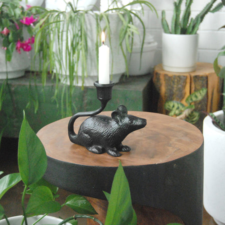 Whimsical black mouse candle holder in modern home décor setting