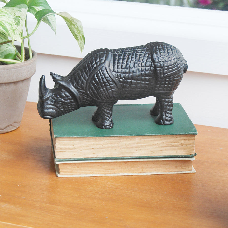 Decorative black rhino figurine with textured finish