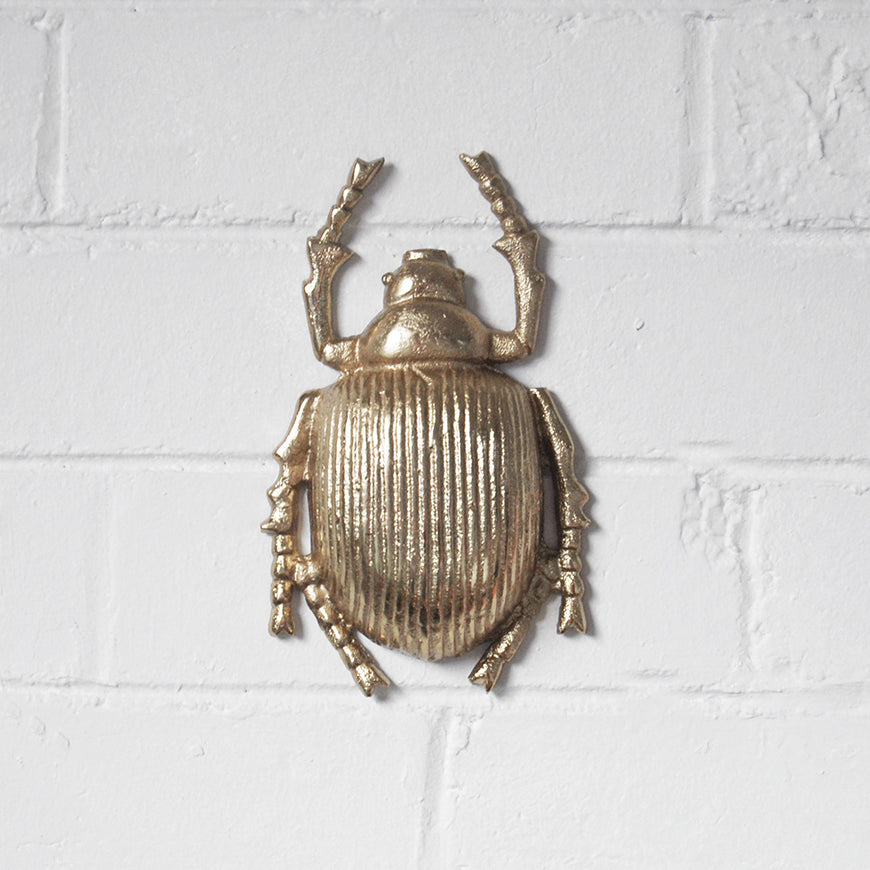 Gold scarab beetle wall mount with detailed shell and built-in hanger