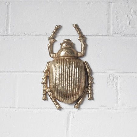 Gold scarab beetle wall mount with detailed shell and built-in hanger