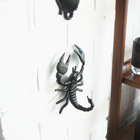 Black scorpion wall mount with textured body and reverse-side hanger