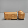 Decorative gold resin trams displayed as functional bookends
