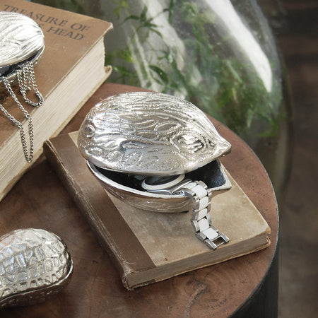 Decorative metallic walnut bowl used for storing watches and small items