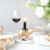 Gold bear candle holder with black candle burning