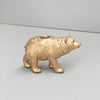 Resin gold bear sculpture used as a candle holder