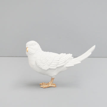 White resin budgie sculpture with gold beak and feet 