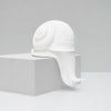 Sculptural white snail by White Moose adding charm to a modern home interior