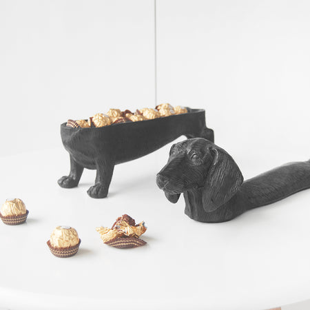 Matte black dachshund bowl with chocolate treats