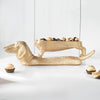 Gold dachshund bowl sculpture filled with chocolates