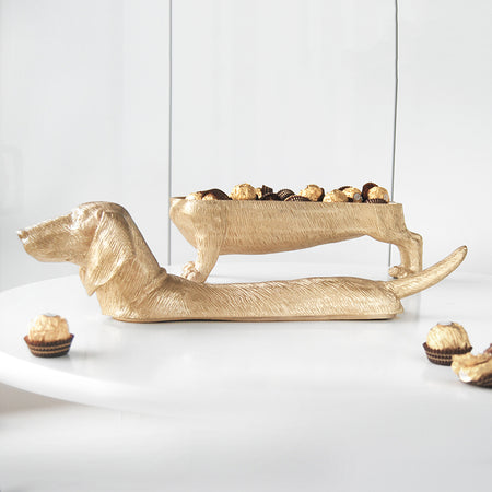 Gold dachshund bowl sculpture filled with chocolates
