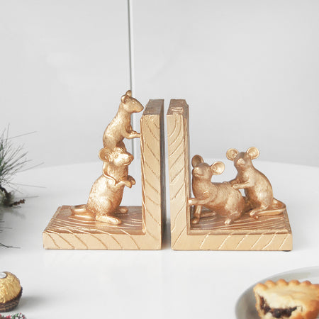 Gold resin mice bookends by White Moose styled on white table