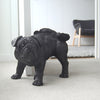 Peeing pug sculpture in matte black by White Moose