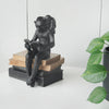 Reading monkey statue by White Moose in bedroom
