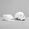 Open white skull showing hidden trinket compartment inside