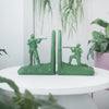 White Moose army bookends used to support books with playful detail
