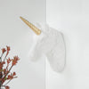 Side angle of unicorn head wall piece showing sculpted mane and gold horn
